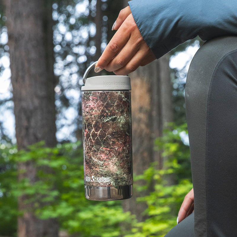 12oz-tkwide-with-twist-cap-mossy-oak-c4 12oz_tumbler_mossyoak_rainbowtrout_hand_closeup_square.jpg