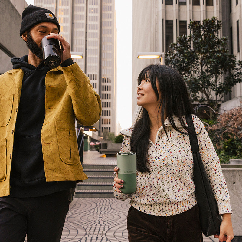 16oz-rise-tumbler-i0 16oz_rise_tumbler_black_iceberg_couple_drink_city_street_square.jpg