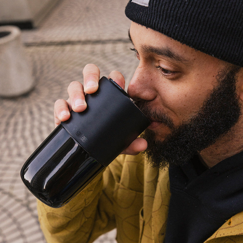 daily-on-the-go-set-k1 16oz_rise_tumbler_black_man_drink_square.jpg