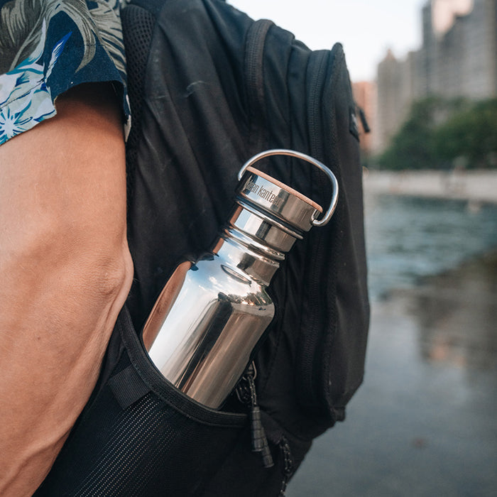 27oz-reflect-with-bamboo-cap-a2 K27SSLRF-MS-BAMBOO_reflect-bottle_backpack_lifestyle.jpg